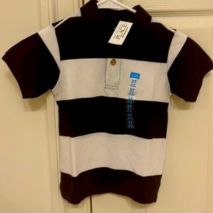 Toddler boy’s short-sleeve piqué polo. White/Tidal stripe. Collar. Two buttons.